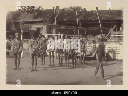 https://l450v.alamy.com/450v/r5by0r/a-burmese-police-guard-at-mandalay-burmah-a-series-of-one-hundred-photographs-illustrating-incidents-connected-with-the-british-expeditionary-force-to-that-country-from-the-embarkation-at-madras-1st-nov-1885-to-the-capture-of-king-theebaw-1886-photograph-source-photo-31295-author-willoughby-wallace-hooper-r5by0r.jpg