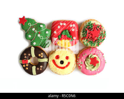 Top View of Many Colorful Christmas Decorated Doughnuts Sweets Isolated on White Background Stock Photo