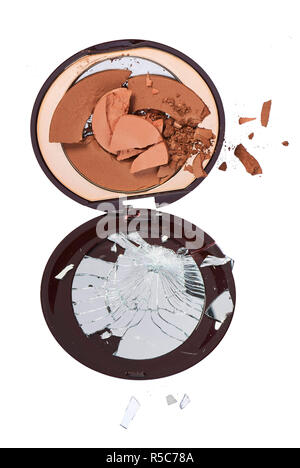 A still life cut out product image of a broken makeup compact on a white background Stock Photo