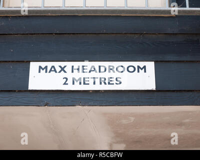 overhead sign warning about max head room Stock Photo