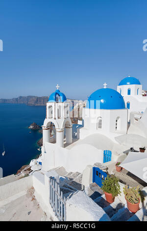 Blue domed churches in the village of Oia (La), Santorini (Thira), Cyclades Islands, Greece Stock Photo