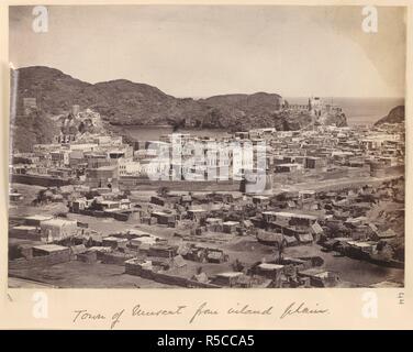 Town of Muscat from inland plain. A view looking over the town towards the harbour, with the city wall in the middle ground. In the background overlooking the harbour, Fort Capitano (left) and Fort Jellalee (right) can be seen. Dunlop Smith Collection: Sir Charles Aitchison Album of Views in India and Burma. c. 1870. Photograph. Source: Photo 355/1(44). Language: English. Author: UNKNOWN. Stock Photo