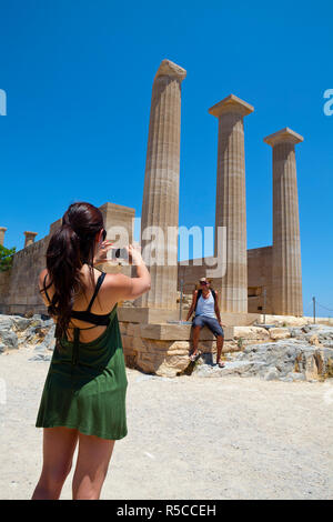 A couple taking photos,  The Acropolis of Lindos, Lindos, Rhodes, Greece, MR Stock Photo