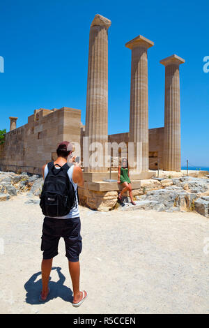 A couple taking photos,  The Acropolis of Lindos, Lindos, Rhodes, Greece, MR Stock Photo