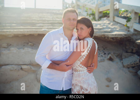 couple photographed on vacation sea, ocean. Against the background of the destroyed Vietnamese staircase Stock Photo
