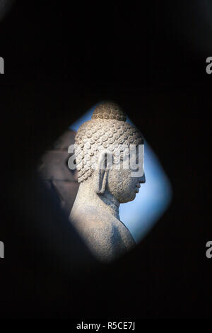 Indonesia, Java, Magelang,  Borobudur Temple, Bhudda image inside Stupa Stock Photo