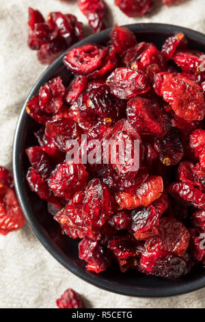 Organic Raw Dry Cranberries in a Bowl Stock Photo