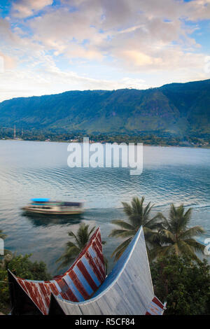 Indonesia, Sumatra, Samosir Island, Tuk Tuk, Typical Batak houses overlooking Lake Toba Stock Photo