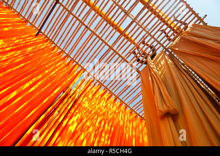 Newly dyed fabric being hung up to dry, Sari garment factory, Rajasthan, India, (MR/PR) Stock Photo