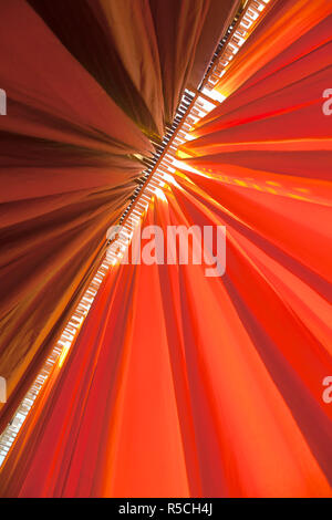 Newly dyed fabric hanging from Bamboo poles to dry, Sari garment factory, Rajasthan, India, (PR) Stock Photo