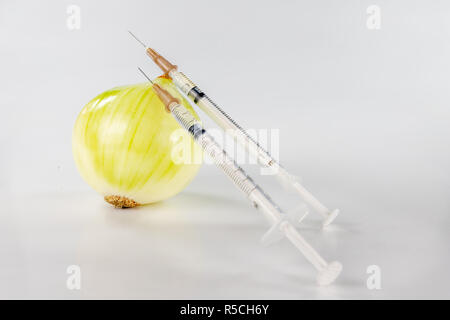 Healthy onion juice for colds. Natural medicine irreplaceable in the home medicine cabinet. White background. Stock Photo
