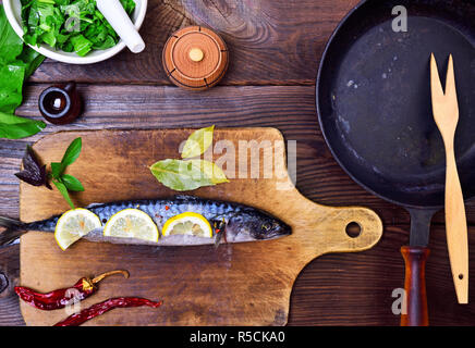 mackerel on a wooden kitchen board Stock Photo