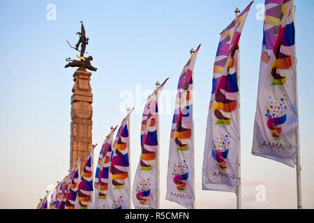 Kazakhstan, Almaty, Respublika Alangy Soviet created ceremonial sqaure, Monument to Independence, stone column surmounted with a replica Golden man standing on a winged snow leopard Stock Photo