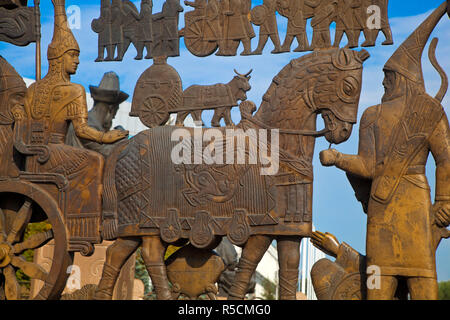 Kazakhstan, Almaty, Respublika Alangy Soviet created ceremonial sqaure, Semicircular wall of low-relief bronze sculputures depicting scenes from Kazakhstan's history Stock Photo