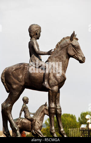 Kazakhstan, Almaty, Respublika Alangy Soviet created ceremonial square Statue of girl on horse near Monument to Independence Stock Photo