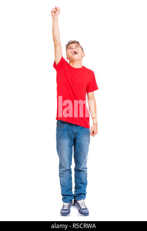 Full length portrait of young caucasian teen boy, isolated on white background. Funny teenager - Superhero with raised up one hand. Handsome child pla Stock Photo