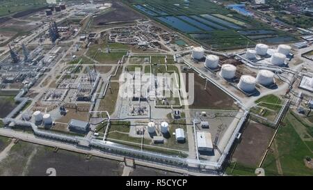 Oil refinery plant for primary and deep oil refining. Equipment and tanks in the oil refinery. Rectification and vacuum equipment. Stock Photo