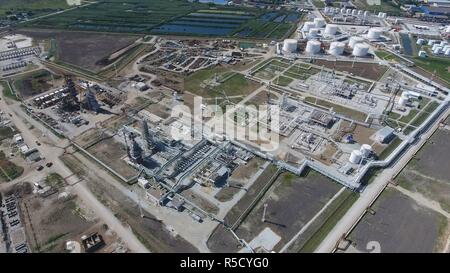 Oil refinery plant for primary and deep oil refining. Equipment and tanks in the oil refinery. Rectification and vacuum equipment. Stock Photo