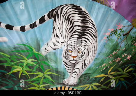 Thailand, Chiang Mai, Borsang Umbrella Village, Artwork of Tiger on Giant Umbrella Stock Photo