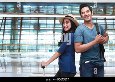 Young asian tourist couple going traveling Stock Photo