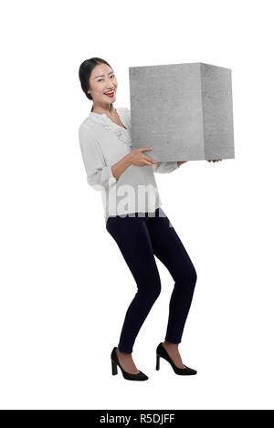 Asian business woman lift heavy box Stock Photo