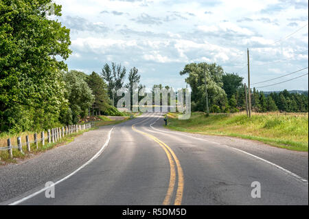 winding country road with no cars or people Stock Photo