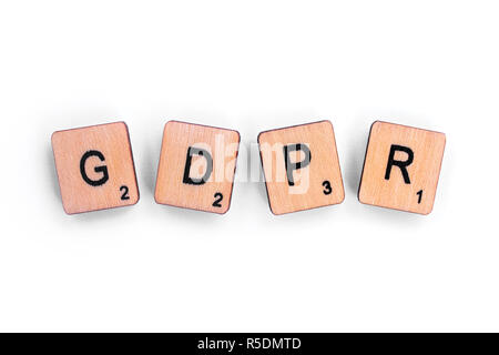 London, UK - July 8th 2018: The abbreviation GDPR - General Data Protection Regulation, spelt with wooden letter tiles over a plain white background. Stock Photo