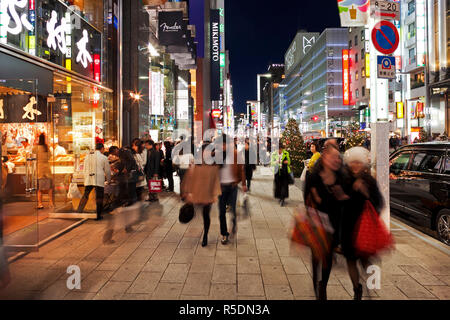 The Tokyo fashionable Ginza street at night. View along rows of ...