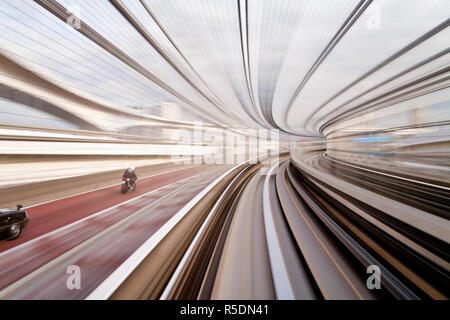 Asia, Japan, Honshu, Tokyo, POV blurred motion of Tokyo buildings from a moving train Stock Photo