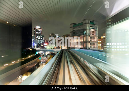 Asia, Japan, Honshu, Tokyo, POV blurred motion of Tokyo buildings from a moving train Stock Photo