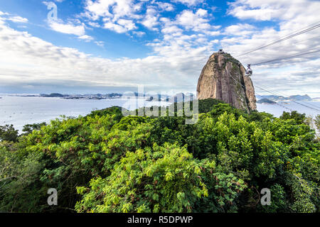 Views to Sugar Loaf mountain and Rio do Janeiro city, suburbs and favelas, amazing views over the bays, islands, beach and the city skyline Stock Photo