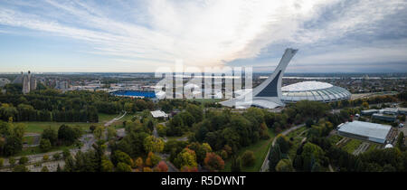 Aerial panoramic view of a modern cityscape during a vibrant day during fall season. Taken in Montreal, Quebec, Canada. Stock Photo