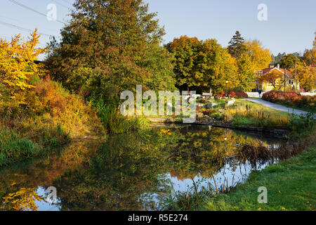 River side and fall season urban cityscape in central Upplands Vasby. Stockholm, Sweden. Stock Photo