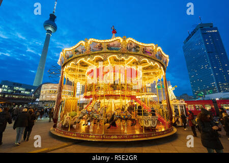 Traditional Christmas Market at Alexanderplatz in Mitte, Berlin, Germany. Pictured double height carousel Stock Photo