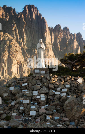 France, Corsica, Corse-du-Sud Department, La Alta Rocca Region, Col de Bavella pass, Aiguilles de Bavella peaks, statue of the Notre Dame des Neiges, Our Lady of the Snows Stock Photo