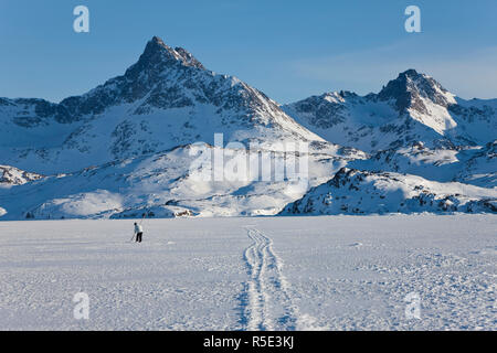 Ice fishing, King Oscar Fijord, Tasiilaq, Greenland, winter Stock Photo
