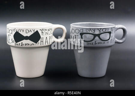 macro set detail of two empty cups of coffee with different color message Stock Photo