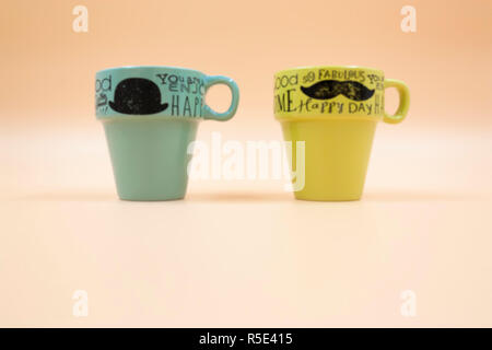 macro set detail of two empty cups of coffee with different color message Stock Photo