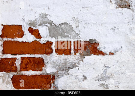 Exposed brick wall. White paint. Stock Photo