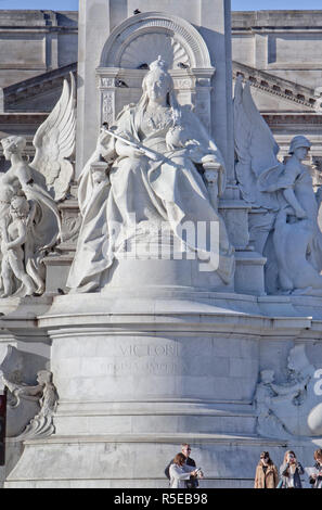 Victoria Memorial. The immense marble statue  of Queen Victoria, by Thomas Brock, is located in front of Buckingham Palace in The Mall, London, UK. Stock Photo