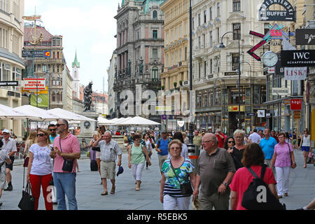 VIENNA, AUSTRIA - JULY 12: People at Graben Street in Wien on JULY 12, 2015. Pedestrians Walking at Main Shopping Street in Vienna, Austria. Stock Photo