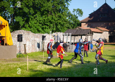 TRAKAI, LITHUANIA - JUNE 16, 2018: People wearing knight costumes during historical reenactment on annual Medieval Festival, held in Trakai Peninsular Stock Photo