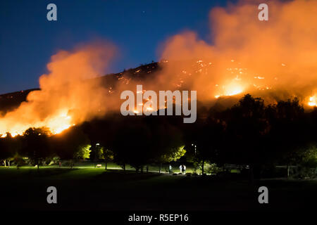 Wildfire Burns Above Park in California nighttime Woolsey Fire Image Stock Photo