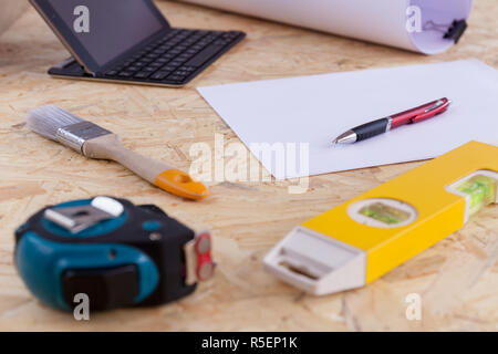 Measuring instruments on the working surface, drawings and contract. Stock photo Stock Photo
