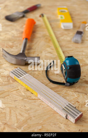Variety of carpentry tools on wooden work surface. Stock photo Stock Photo