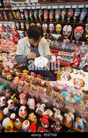 China, Beijing, The Silk Market, Artist Painting Chinese Mask Stock Photo
