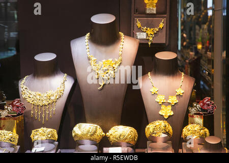 China, Macau, Jewellery Shop Window Display of Gold Bracelets and Necklaces Stock Photo
