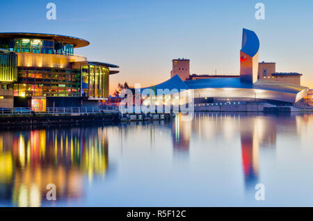 UK, England, Greater Manchester, Salford, Salford Quays, Imperial War Museum North with The Lowry's Quays Theatre on left Stock Photo