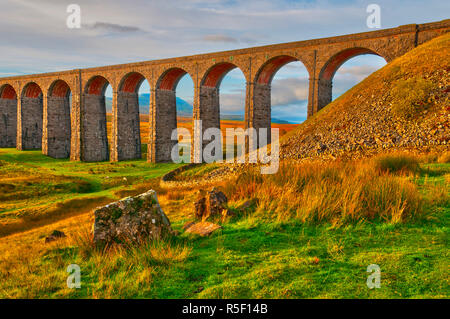 UK, England, North Yorkshire, Ribblehead Viaduct on the Settle to Carlisle Railway Line, Whernside Mountain beyond, one of the Yorkshire Three Peaks Stock Photo