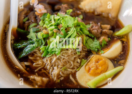 noodles or Japanese ramen soup with pork and egg in restaurant Stock Photo